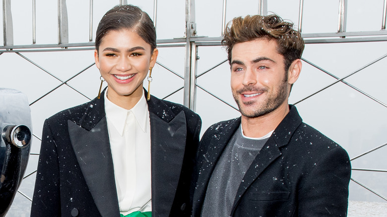 Zendaya and Zac Efron smiling