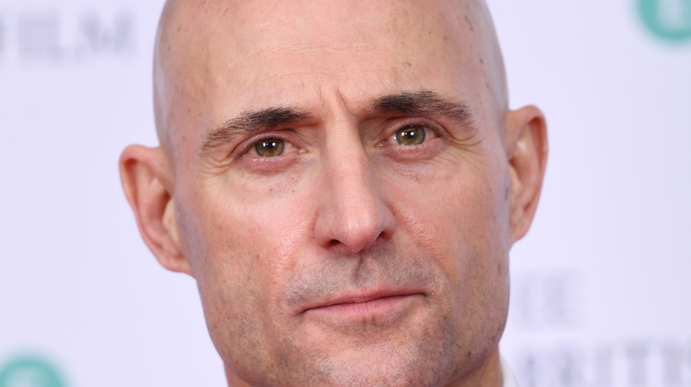 Mark Strong poses