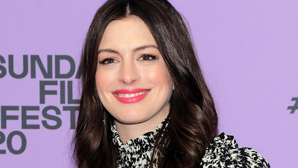 Anne Hathaway smiling on the red carpet