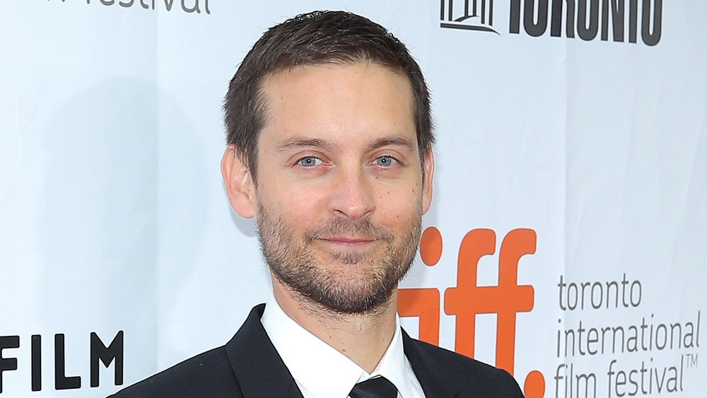 Tobey Maguire smirking