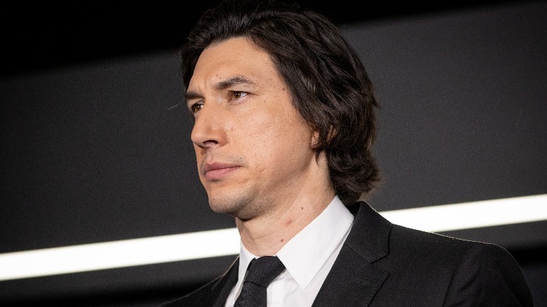 Adam Driver with a serious facial expression