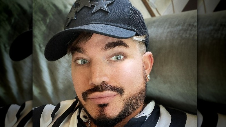 Adam Lambert wearing a hat