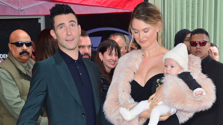 Adam Levine and Behati Prinsloo with child