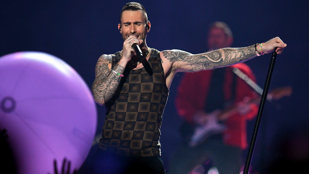 Adam Levine performing on stage