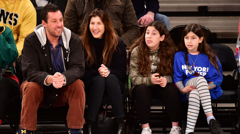 Adam Sandler with his family at a basketball game