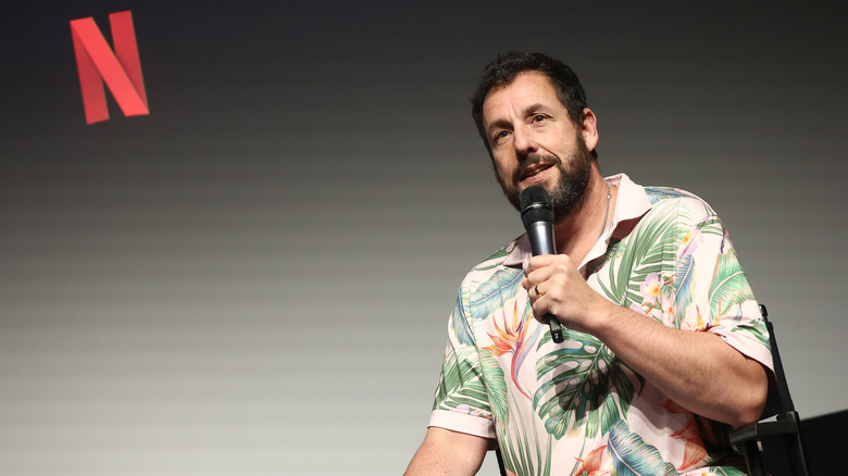 Adam Sandler speaking at a Netflix event