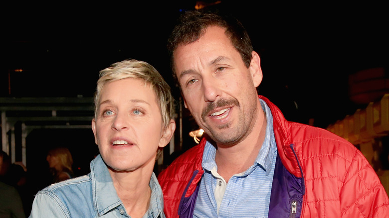 Ellen DeGeneres and Adam Sandler posing