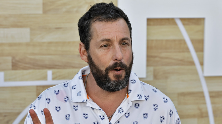 Adam Sandler giving peace sign