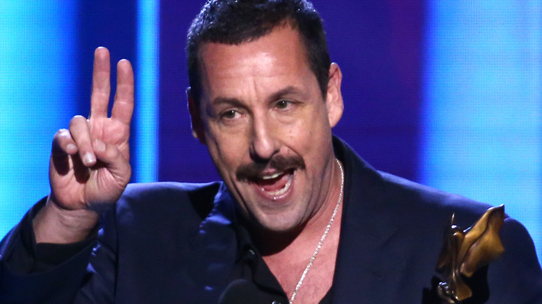 Adam Sandler giving an acceptance speech