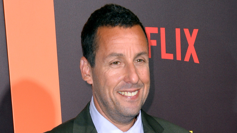 Adam Sandler in a black suit