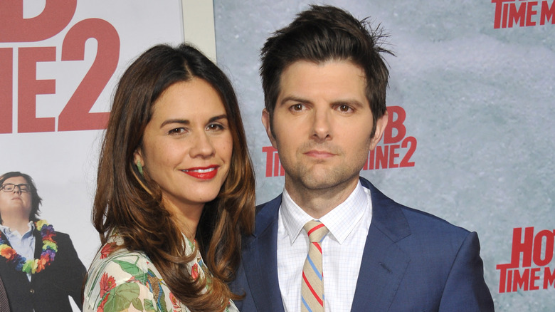 Naomi Scott and Adam Scott posing at an event