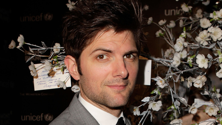 Adam Scott posing with flowers