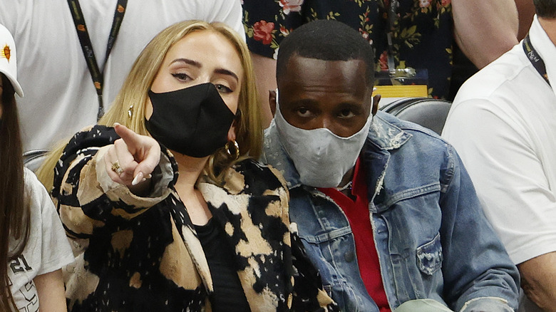 Adele and Rich Paul wearing masks