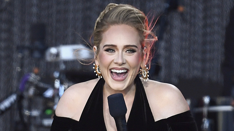Adele smiling on stage