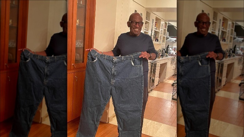 Al Roker holding his over-sized jeans