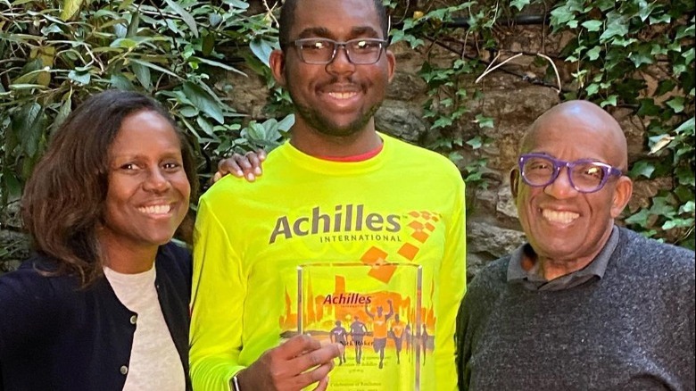 Deborah Roberts, Nick and Al Roker smile in a photo