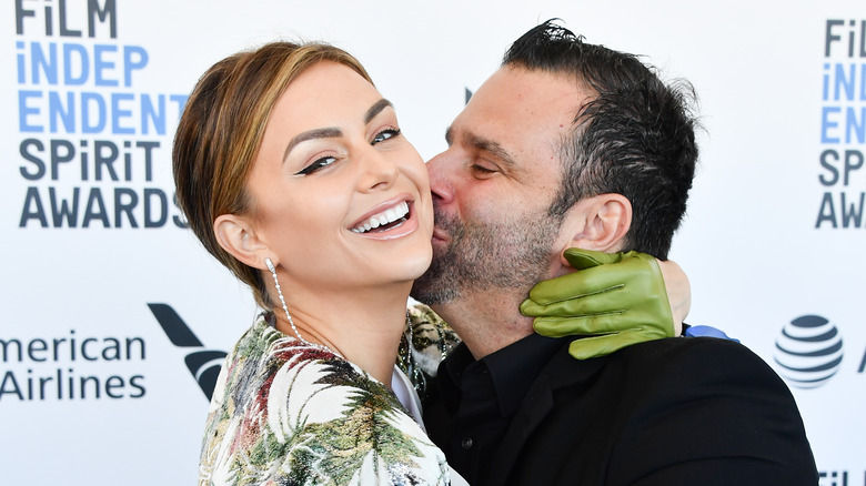 Lala Kent, Randall Emmett kissing on a red carpet. 