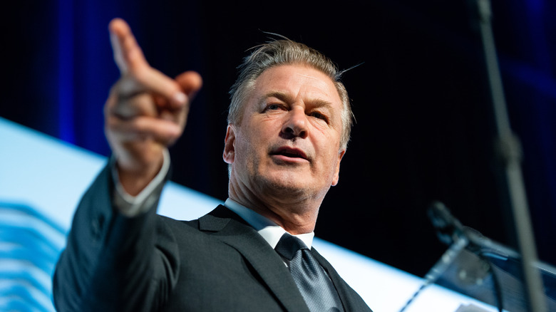 Alec Baldwin speaking and pointing