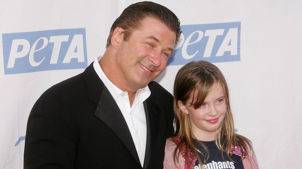 Alec and Ireland Baldwin smiling at a PETA event 