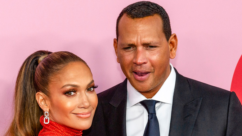 Jennifer Lopez smiling Alex Rodriguez looking confused