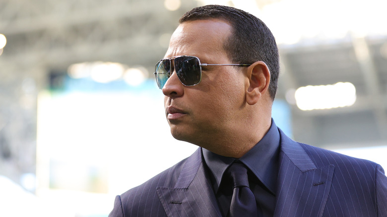 Alex Rodriguez wearing sunglasses and a suit