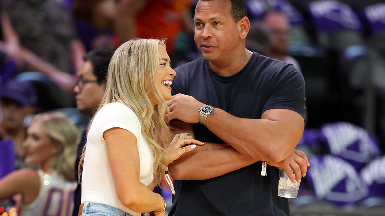 Alex Rodriguez and Kathryne Padgett flirt at a basketball game