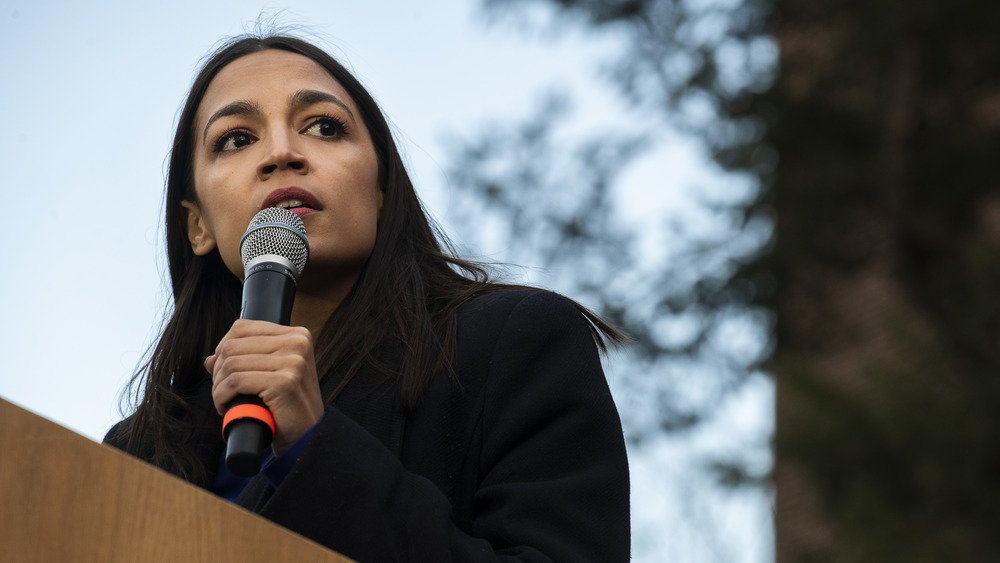 Alexandria Ocasio-Cortez speaking at an outside event