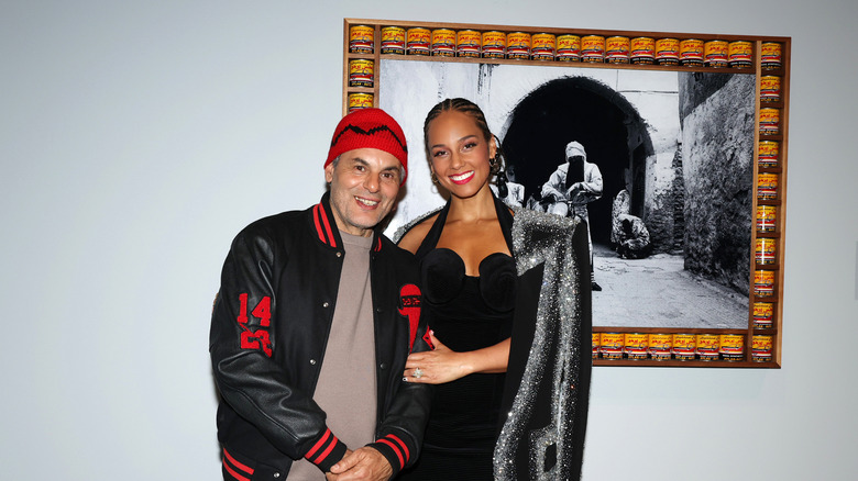 Alicia Keys posing with a Giants artist