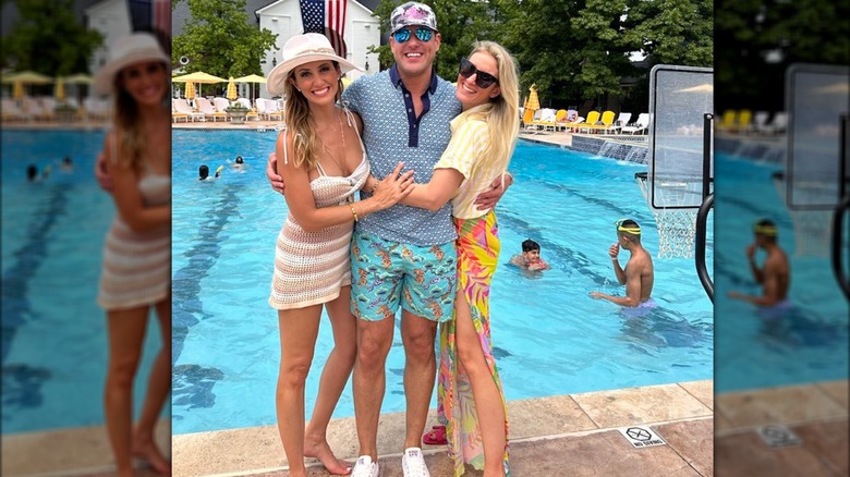 Alina Habba posing with friends next to the pool