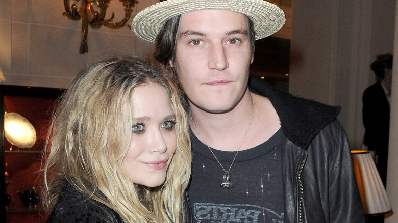 Nate Lowman and Mary-Kate Olsen posing  