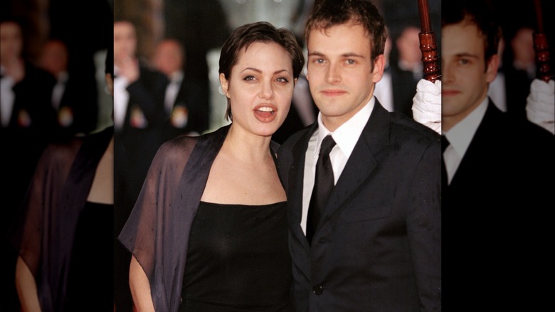 Jonny Lee Miller and Angelina Jolie on a red carpet