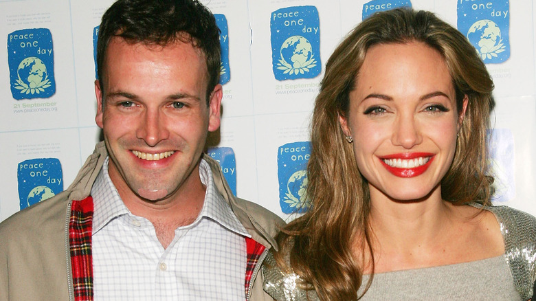 Jonny Lee Miller and Angelina Jolie on a red carpet