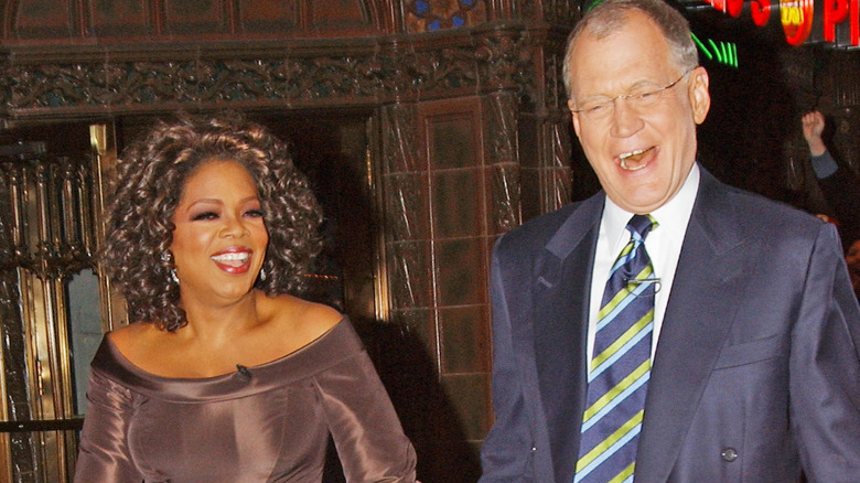 Oprah Winfrey and David Letterman laughing