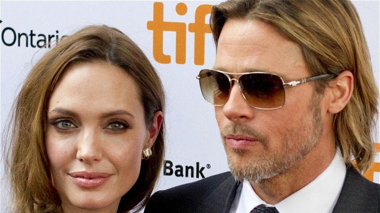 Brad Pitt wearing shades, Angelina Jolie