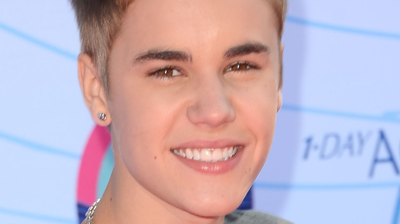 Justin Bieber grinning at an event