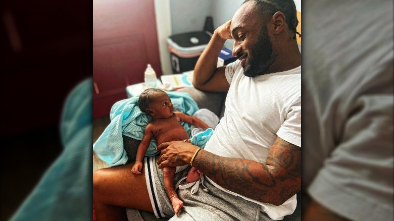 Woody Randall with baby son