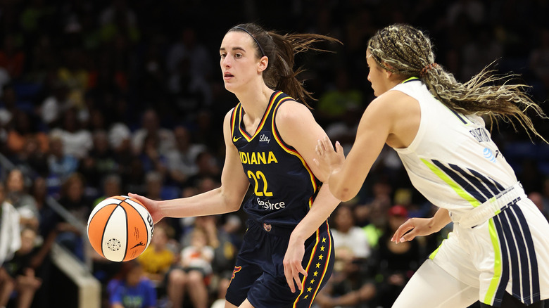 Caitlin Clark playing basketball