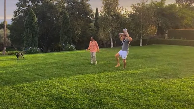 Doria Ragland, Prince Harry and Prince Archie playing together.