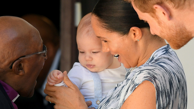 Prince Archie, Meghan Markle and Prince Harry with Archbishop Desmond Tutu.