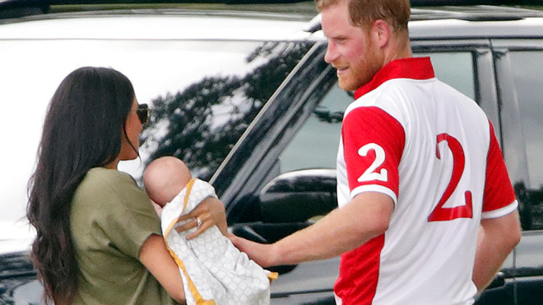 Meghan Markle and Prince Harry outside with Prince Archie