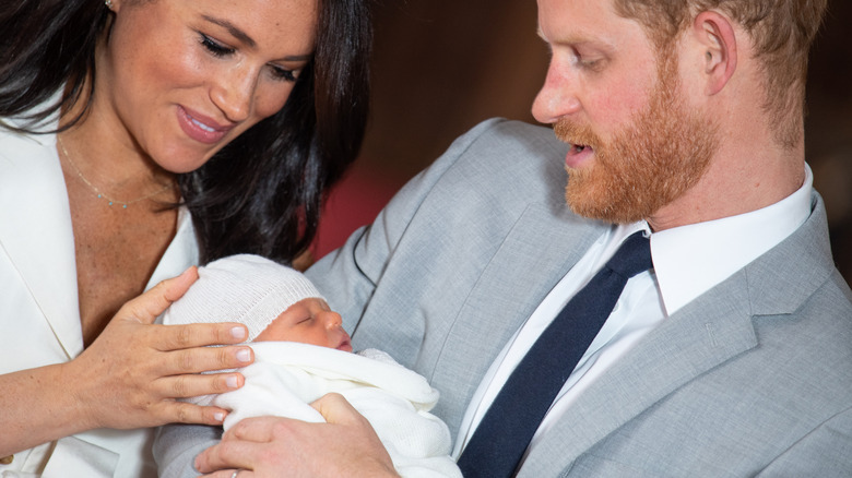 Prince Harry and Meghan Markle looking at Prince Archie