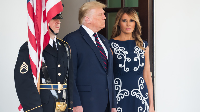 Donald and Melania Trump standing tall