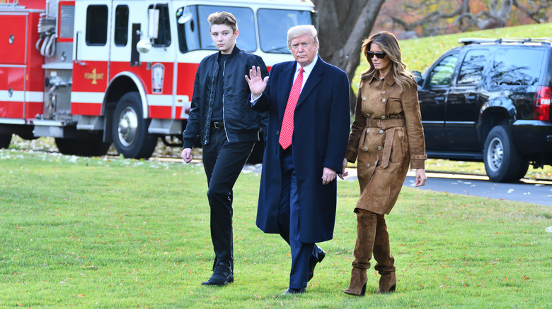 Barron, Donald, and Melania Trump walking