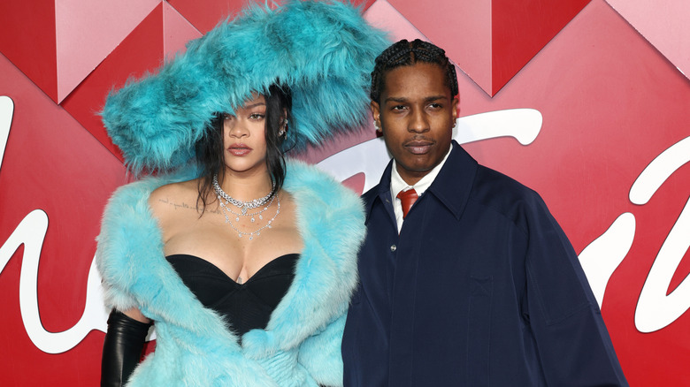 Rihanna and ASAP Rocky, posing at an event