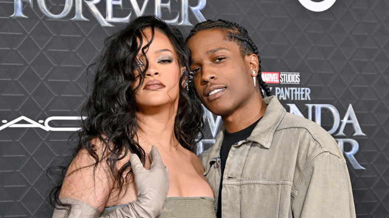 Rihanna and ASAP Rocky, posing at an event