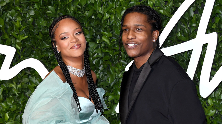 Rihanna and ASAP Rocky, posing at an event