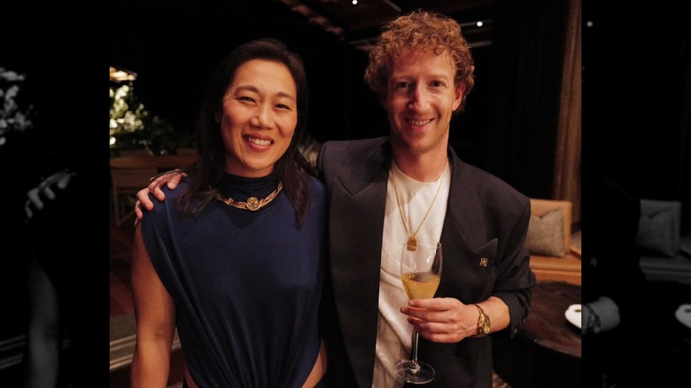 Priscilla Chan and Mark Zuckerberg holding champagne