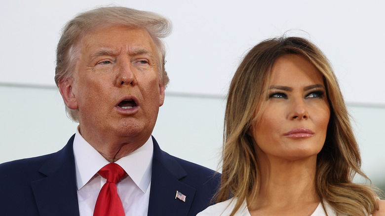 Donald and Melania Trump look upwards