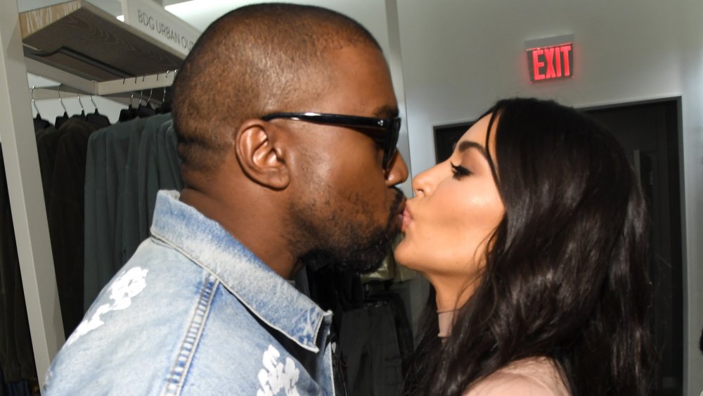 Kanye West and Kim Kardashian West kissing