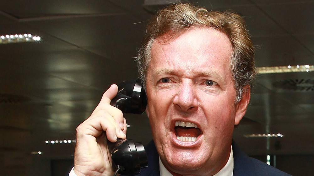 Piers Morgan yelling into a phone